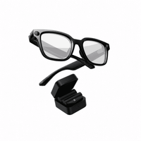 Matte black smart glasses floating above open charging case with detachable temple arm